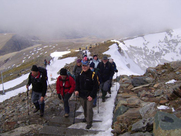 4.Snowdon. Snowdon Ranger Path. Celebrating Arwel Davies' 80th Birthday.
Arwel leading the group up the steps.
Photo: Meirion Owen.
Keywords: Apr10 Thursday Arwel