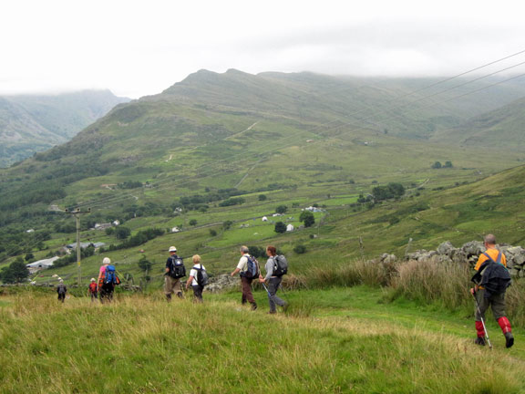 5.Moel Cynghorion to Moel Eilio
Approaching the end of the descent from Moel Elio. The Llanberis path can be seen on the mountainside ahead. The day actually ended back at "Y Bwthyn Té - Pen Ceunant Isaf as members joined Jos to celebrate his 70 birthday with Belgian (Flanders flavoured) Hot Chocolate and cream scones. 
Keywords: July10 Sunday Robert Herve