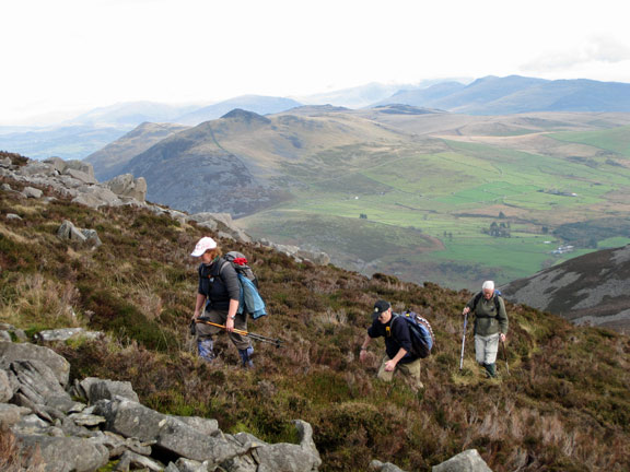 4.Yr Eifl, Nant Gwtheyrn 31/10/10.
Catrin, Tecwyn and John ascending Yr Eifl. Moel Pen-llechog, Gyrn Ddu and Gyrn Goch in the background.
Keywords: Oct10  Sunday Judith Thomas
