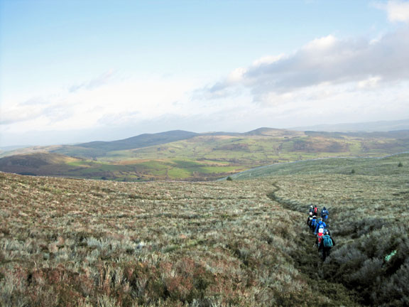 4.Mynydd Nodol.
On our way down from Mynydd Nodol and ready for our lunch, but not in the wind.
Keywords: Nov11 Sunday Noel Davey Tecwyn Williams