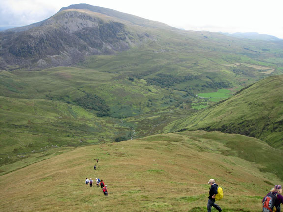 6.Nantlle Ridge
21st August 2011. Finally descending into Cwm Pennant with our final destination, the cars, just visible where the fields start on the valley bottom on the right
Keywords: Aug11 Sunday Noel Davey