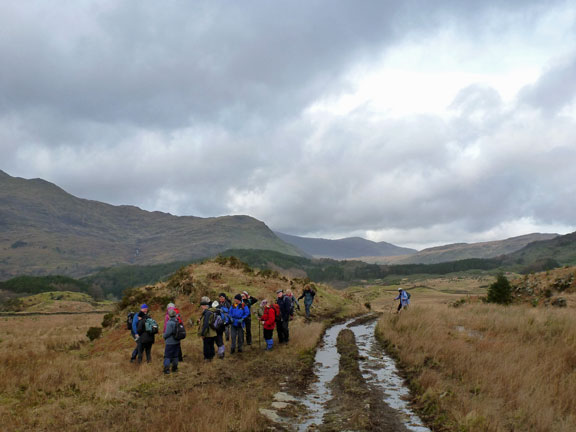 5.Beddgelert.
22/01/12. On the path running east to west from Blaen Nanmor to Llyn Dinas. Rhian joins the main party after researching the properties of the local mud.
Keywords: Jan12 Sunday Kath Mair