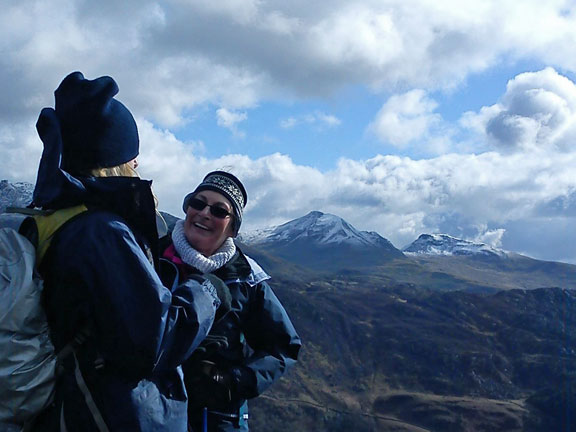 3.Beddgelert,Sygun,Cwm Bychan
4/3/12. Up on top of Moel y-Dyniewyd. Our leader takes a break. The snow capped Moelwyns in the background. Photo: Rowy Richards
Keywords: Mar12 Sunday Judith Thomas