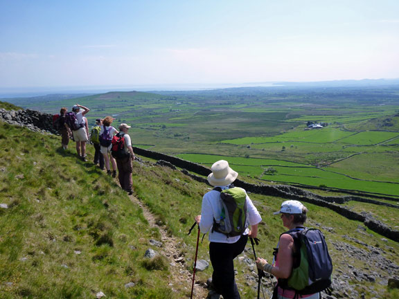 5.Llangybi, Bronmiod, Pen y Gaer, three hills and a ffynnon.
27/5/12. Walking along the side of Pen-y-Gaer, some 90 metres below the summit. We will throw a left in a moment. The Llyn Peninsular in the background.
Keywords: May12 Sunday Catrin Williams Noel Davey