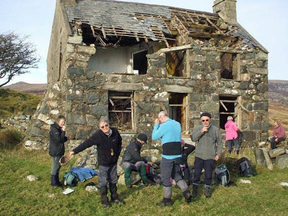 4.Cwm Pennant
29/11/12. Llwyn y Bettws. Tecwyn is showing off one of Dafydd's many walking caps and a detailed house inspection is going on in the background. Photo & Captions' outline Dafydd H Williams.
Keywords: Nov12 Thursday Kath Mair