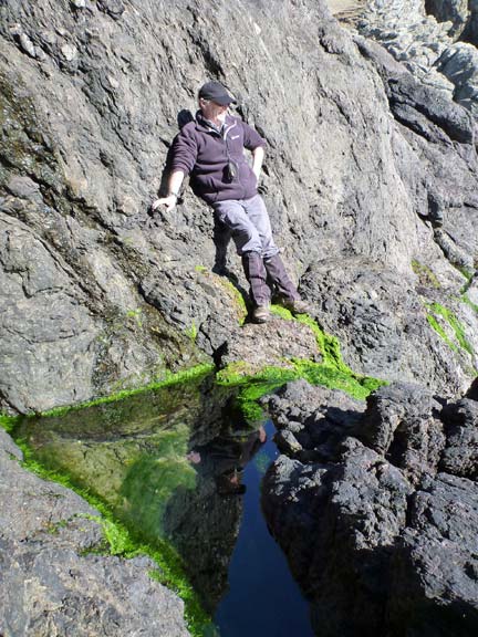 4.Porth Oer to Aberdaron
16/3/14. After lunch a quick visit to Saint Mary's Well at the foot of Mynydd Mawr. Tecwyn poses for the camera to give us some idea of scale.
Keywords: Mar13 Sunday Roy Milnes