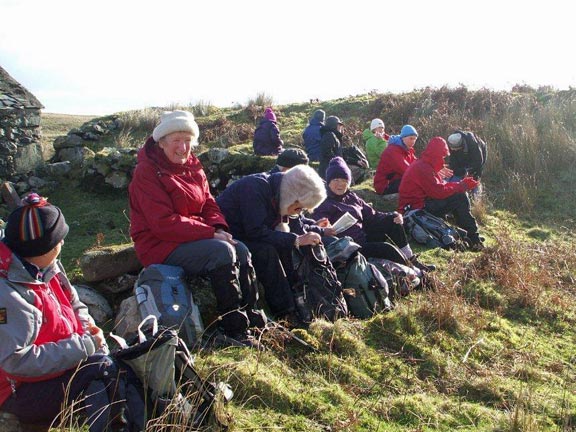 5.Cwm Pennant circular
1/2/15. Coffee break at Cae-Amos. A welcome cold wind break. Photo: Dafydd Williams.
Keywords: Feb15 Sunday Kath Mair