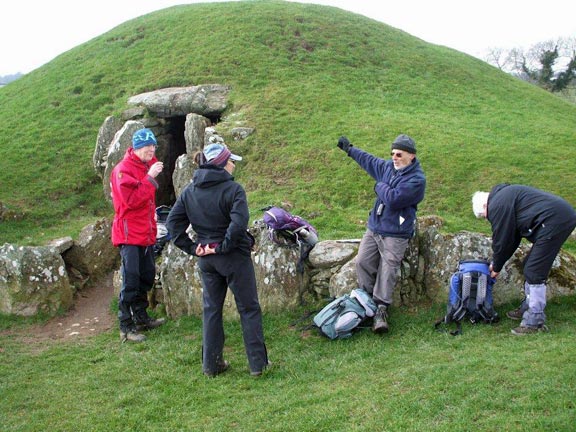 4.Gaerwen – Bryn Celli Ddu
15/03/15. A planned coffee break with archaeological content. Noel provides the content to a well behaved audience. Rip Van Winkletec was in his element. Photo: Dafydd Williams.
Keywords: Mar15 Sunday Noel Davey