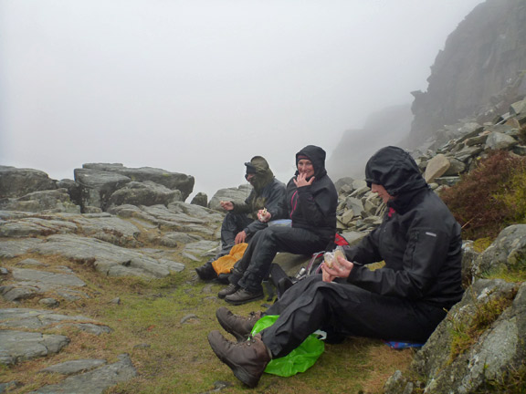3.Rhinog Fawr
12/04/15. A rather battered group has its lunch in the wind and the rain after turning back within 45 metres of Llyn Du. Wind speeds gusting up 70 mph made it dangerous to continue. We will do Rhinog Fawr next year.
Keywords: Apr15 Sunday Noel Davey