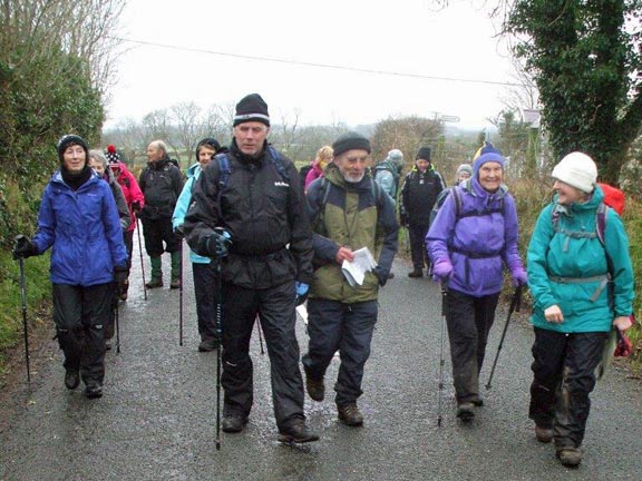 3.Llangybi
21/1/16. The leader did attempt to keep off the dreadfully muddy paths by walking on the tarmac from time to time. Everyone looks happy. Photo: Dafydd H Williams.
Keywords: Jan16 Thursday Kath Mair