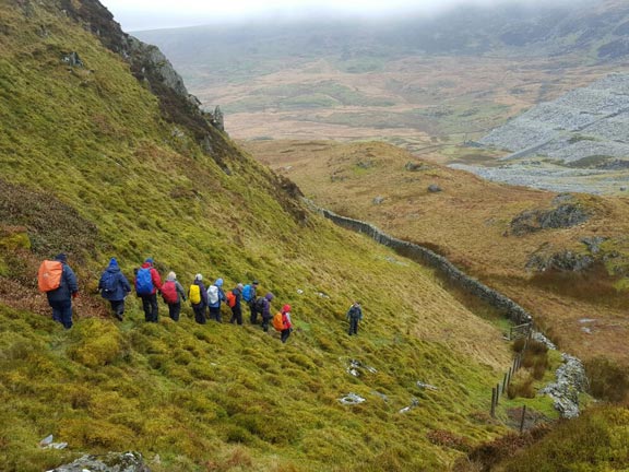 5.Moel Ddu
12/3/17. On our way down Moel-ddu out of the wind, the cloud lifts for a short time. There is scenery. Brilliant. The disused Gorseddau Quarry can be seen in the background. Photo: Judith Thomas.
Keywords: Mar17 Sunday Tecwyn Williams