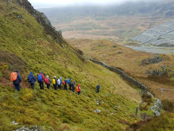 5.Moel Ddu
12/3/17. On our way down Moel-ddu out of the wind, the cloud lifts for a short time. There is scenery. Brilliant. The disused Gorseddau Quarry can be seen in the background. Photo: Judith Thomas.
Keywords: Mar17 Sunday Tecwyn Williams