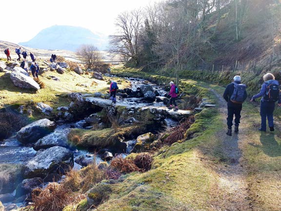 3.Arthog - Cregennen Lakes
25/3/18.   Approaching our morning break picnic spot, near Llys Bradwen, over a bridge over Afon Arthog. Photo: Judith Thomas.
Keywords: Mar18 Sunday Nick White