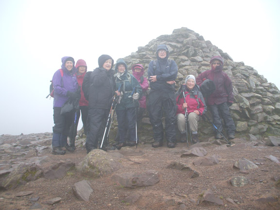 32.Exmoor Spring Holiday
17/4/18. The second of our groups to reach the beacon pose for a photo in the lee of the beacon before having morning break. Photo: Dafydd Williams.
Keywords: Apr18 week Hugh Evans