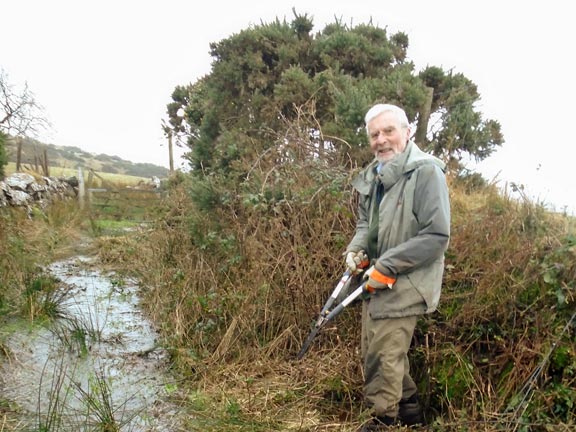 1. Footpath Clearing
21/1/2020. Is it a path or a stream? Path clearing between Clynnog and Bwlch Mawr, by five members of the club. Only three photographed! Photo: Dafydd Williams
Keywords: Jan20 Noel Davey