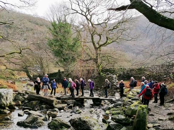 3.Beddgelert - Dinas Emrys
13/01/22.  After lunch the group moves off over the fine stone clapper bridge. Photo: Tecwyn Williams.
Keywords: Jan22 Thursday Annie Michael