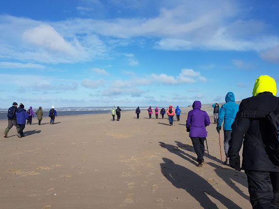3. Dinas Dinlle - Fort Belan 
24/02/22.  Getting closer to Fort Belan on flat hard sand. The Anglesey Coast can be seen on the horizon. Photo: Megan Mentzoni
Keywords: Feb22 Thursday Derek Cosslett