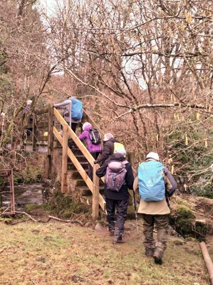 4.Llanystumdwy Circuit
3/3/22. Foot bridge across Afon Dwyfach close to Tyddyn-du. Photo: Louise Baldwin.
Keywords: Mar22 Thursday Kath Spencer