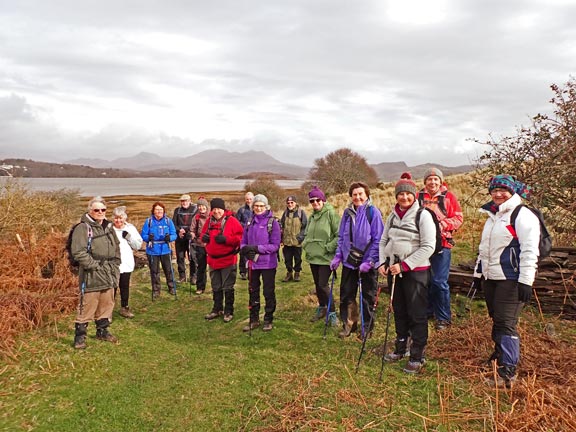 3.Cylchdaith Ynys Circular
17/2/22. A pause for the team photograph before we moved off after our morning tea/coffee break.  I the back ground: looking over Afon Dwyryd to the Moelwyns and Cnicht.
Keywords: Feb22 Thursday Tecwyn Williams