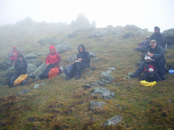 1.Carneddau, Bera Bach, Bera Mawr.
28/04/13. A very soggy late lunch. Can you spot the yoghurt pot? Third time unlucky with the weather. Photo: Dafydd Williams.
Keywords: April13 Sunday Pam Foster Diane Doughty