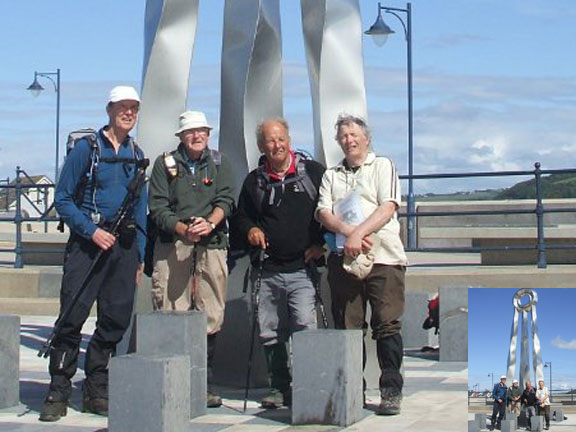 2.Offa's Dyke, North Section
15/06/13. Seven days later. Standing under the sculpture which marks the northern end of the Offa's Dyke path at Prestatyn. We covered 101.5 miles on the path which was only 96.9miles long!  We take our hats off to Heather, Jude and friends who did the whole length of the path in one go - amazing. Photo: Dafydd Williams.
Keywords: June13 Offas Dyke