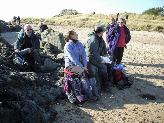 5.Newborough Warren
17/2/12. Lunch at last. On Llanddwyn beach at Ro Bach. Lunch delayed so that we could get off the island before high tide. Photo: Dafydd Williams.
Keywords: Feb13 Sunday Kath Mair