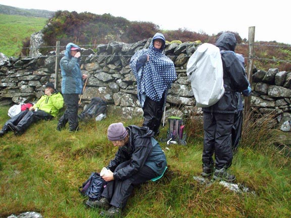 1.Rhinogydd circular
23/06/13. Morning coffee break, with the coffee well diluted by the rain. The wall makes a convenient shelf and shelter. Photo: Dafydd Williams.
Keywords: June13 Sunday Dafydd Williams