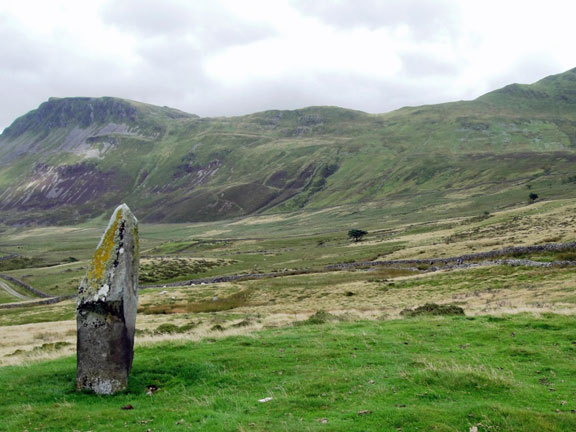 1.Craig y Llyn a Braich Ddu. A walk.
18/08/13. The top of the standing stone points to a section of the path to the ridge.  Tyrrau Mawr is the peak on the left. Craig-y-Llyn is out of the picture to the right. Photo: Roy Milner.
Keywords: Aug13 Sunday Noel Davey