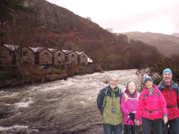 7. Around Moel Dyniewyd
20/12/15. The leading group brought together for the photograph as they enter Beddgelert. 4 photos in one.  Photo: Dafydd H Williams (3), Hugh Evans(1). Then we were off to Dafydd & Catherine's house where we were treated to a mince pie tea.
Keywords: Dec15 Sunday Hugh Evans