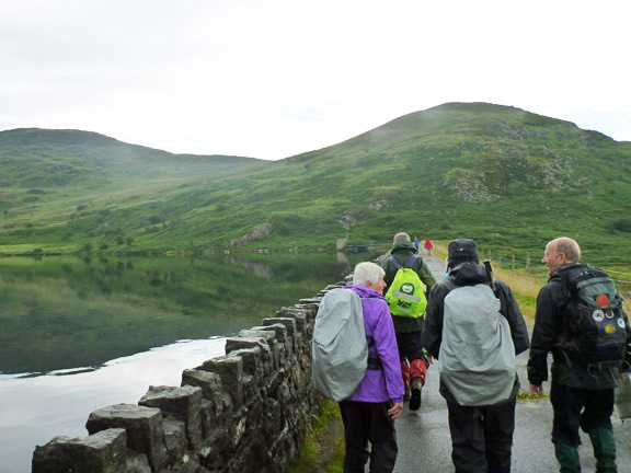 4.Tremadog – Cwm Ystradllyn circ
2/8/15. Lunch over. The rain has almost stopped as we cross the dam.
Keywords: Aug15 Sunday Ian Spencer