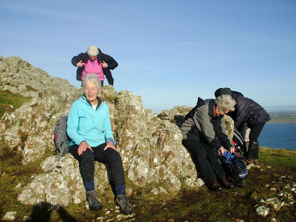 1.Uwchmynydd / Porth Meudwy
8/12/16. Lunch at Pen-y-Cil. The leader takes advantage of the good weather.  Photo: Dafydd Williams.
Keywords: Dec16 Thursday Marian Hopkins