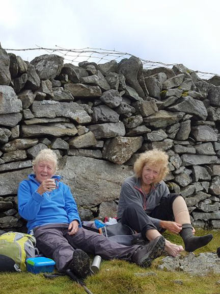 4.Diffwys South
16/7/17. Lunchtime on the windy (North) side of the wall at the Diffwys summit to keep the midges away and to cool off. Photo: Judith Thomas.
Keywords: jul17 Sunday Hugh Evans