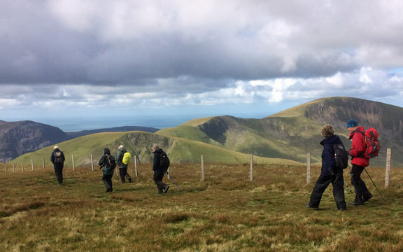 3.Cynghorion
23/9/18. Walking along the ridge from the summit of Moel Cynghorion with Foel Coch, Foel Gron and Moel Eilio in the background. Photo: Anet Thomas.
Keywords: Sep18 Sunday Dafydd Williams