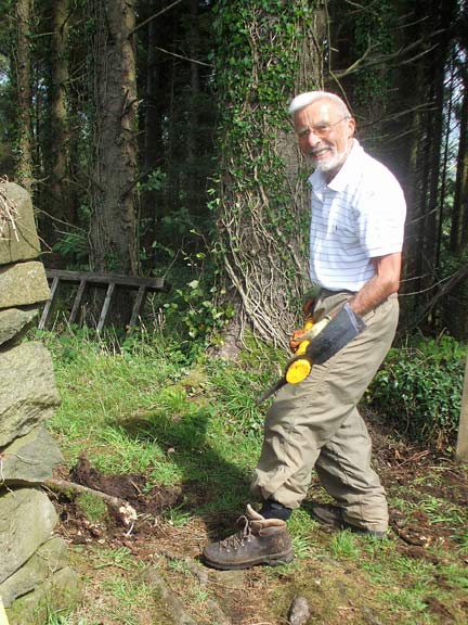 1.Path Maintenance - Pilgrims' Route to Bardsey
20/8/18.  Our secretary puts his best foot forward at Ffynnon Saint. In forestry on the west side of Mynydd Rhiw. Photo: Dafydd Williams.
Keywords: Aug18 maintenance Noel Davey