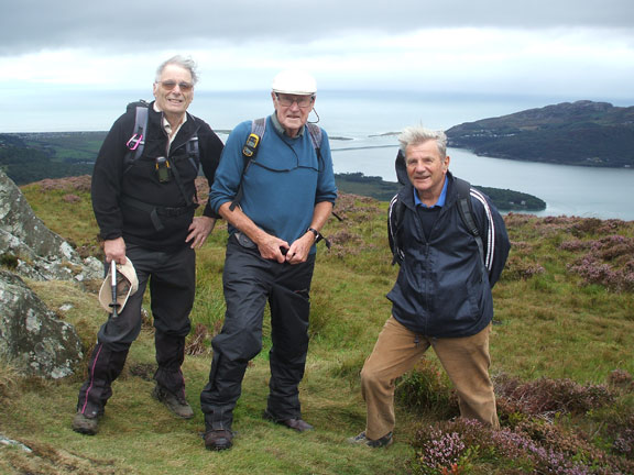 3.Pared y Cefn hir (B  walkers) 
12/8/18. On top of Pared y Cefn hir with the mouth of the Mawddach Estuary and Barmouth in the background. Photo: Dafydd Williams.
