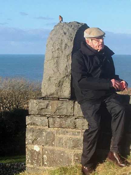 4.Nefyn-Gwylwyr-Pistyll-Coast Path
2/12/21. Dafydd joins a robin for a rest in the cemetery at the Church of St Beuno, Pistyll. Photo: Glyn Roberts.
Keywords: Dec21 Thursday Gwynfor Jones
