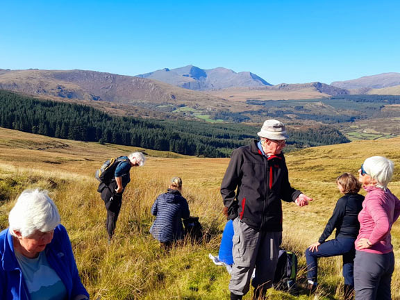 3.Dolwyddelan-Cwm Penamnen-Castle
13/10/22. Lunch at the top with fantastic views over to yr Wyddfa, Crib Goch,  Crib Y Ddysgl and Lliwedd.  Photo: Judith Thomas.
Keywords: Oct22 Thursday Dafydd Williams