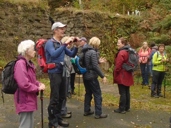 3.Amgylch Penrhyndeudraeth Circular
27/10/22. Inside the Cooks Powder Works Nature Reserve and standing outside one of the workshops, which like all of them is  surrounded by a wall of cement. The wall, with its entrance, can be seen behind the the walkers. Photo: Dafydd Williams.
Keywords: Oct22 Thursday Tecwyn Williams