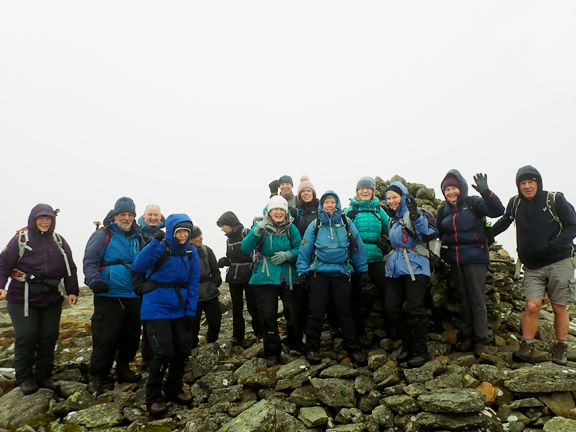 3.Arenig Fach
19/02/23. At the top of Arenig Fach with the group standing around Carnedd Bachgen. The trig point is behind the group on the left. 
Keywords: Feb03 Sunday Gareth Hughes