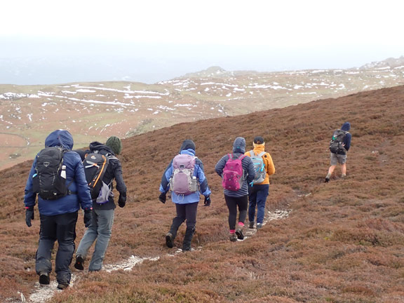 6.Penmaenmawr
12/3/23. Leaving the lesser peak of Foel Lûs to make our way down towards Penmaenmawr. 
Keywords: Mar23 Sunday Jean Norton Annie Andrew