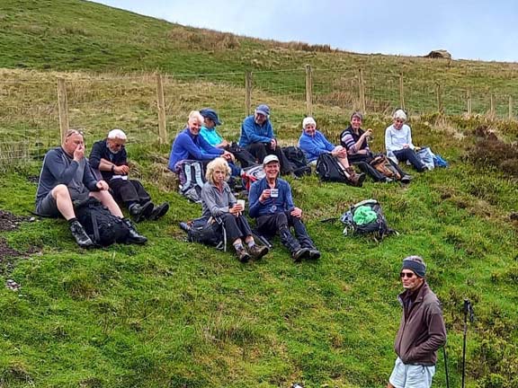 4.Tarren Hills
7/5/23. The morning refreshment break looking down the way that we had come up. We still have the long walk up the ridge to the summit of Tarrenhendre ahead of us.  Photo: Eryl Thomas.
Keywords: May23 Sunday Gareth Hughes