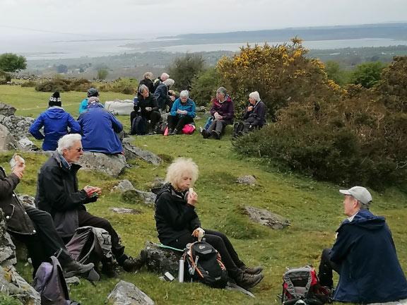 6. Peacock Walk- Bontnewydd - Waunfawr.
25/04/24. Lunch at the highest point of the walk. To the right Afon Gwyrfai and in the background Caernarfon with Anglesey beyond. Photo: Tecwyn Williams. 
Keywords: Apr24 Thursday Tecwyn Williams