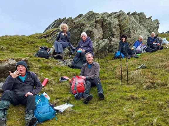 5. Moelwyn Bach, Lakes and foothills.
21/4/24. Lunch just below the summit of Moel-y-hydd. A comfortable location just out of the cold breeze. Photo: Eryl Thomas.
Keywords: Apr24 Sunday Adrian Thomas