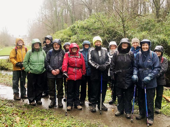 1. Glynllifon Park
26/2/26. Out in the fresh air, and rain, and still smiling. The group is standing on the eastern side of the mansion in an area called the Lime Avenue which had three large fountains along it in the 1840's and now only has one. The east end of the mansion can be seen in the background on the left. Photo: Miriam Heald,
Keywords: Feb26 Thursday Miriam Heald