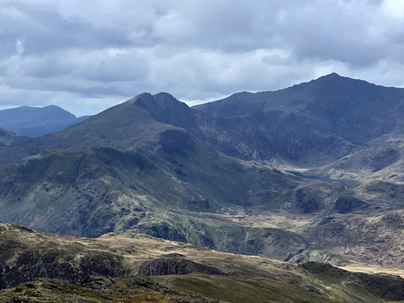 7. Moel Siabod (A group)
19/04/26. From the summit facing west. Centre background Y Lliwedd &  Gallt y Wenallt. Left background: Y Wyddfa. Photo: Mags McQuilling Jones.
Keywords: Apr26 Sunday Gareth Hughes