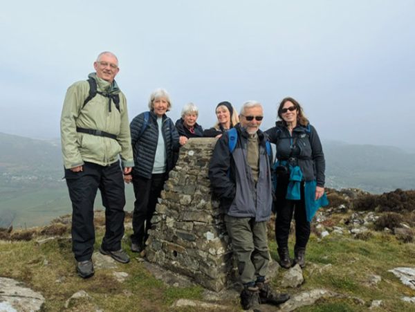 2. Porthmadog - Moel-y-Gest
22/3/26. The trig point at the top of Moel-y-Gest. Happy days. Photo: Debbie Lucas.
Keywords: Mar26 Sunday Noel Davey