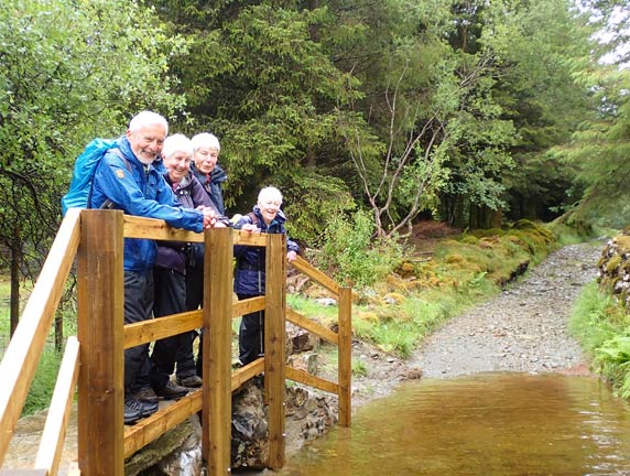 3.Llanfachreth - 'Coed-y-Brenin'
16/07/23. Crossing the stream close to Tyddyn-du. m Thank goodness for the newly rebuilt bridge. (We had met the workmen on one of the recces). 
Keywords: Jlu23 Sunday Hugh Evans