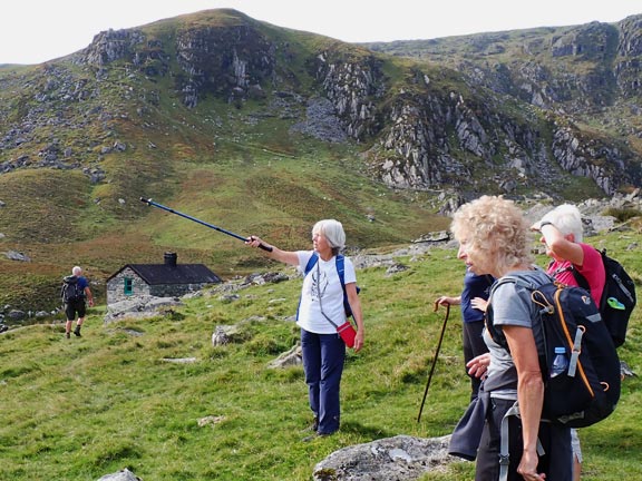 5.Talybont/Conway Valley - Dulyn & Melynllyn Reservoirs
8/10/23. The track on the other side of the valley is spotted but the leader is determined to have lunch at the bothy just ahead of him. The path we will take after lunch can be seen crossing from right to left above the head of the group.
Keywords: Oct23 Sunday Eryl Thomas