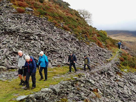 7. Talysarn-Mynydd Cilgwyn - Moel Tryfan.
15/12/24. Into the Dorothea Quarry area, threading our way past large slate waste heaps and deep quarries. Not far from the end of the walk. 
Keywords: Dec24 Sunday Hugh Evans