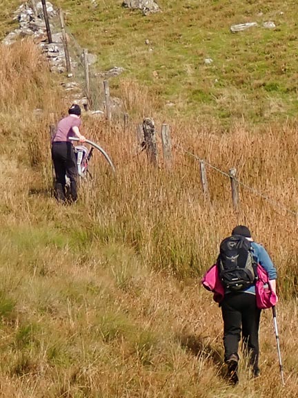 2. Cwm Prysor
6/9/2026. At the foot of Bwlch y Bi and a pipe plastic insulation is being deployed to protect us from the barbed wire as we cross the fence.
Keywords: Sep26 Sunday Noel Davey Annie Andrew